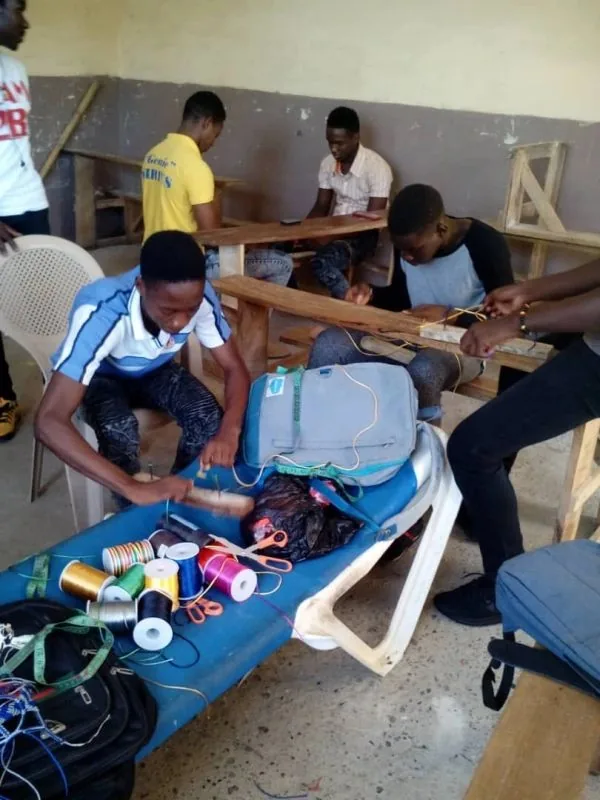 Young people learning a trade in a LYNN workshop